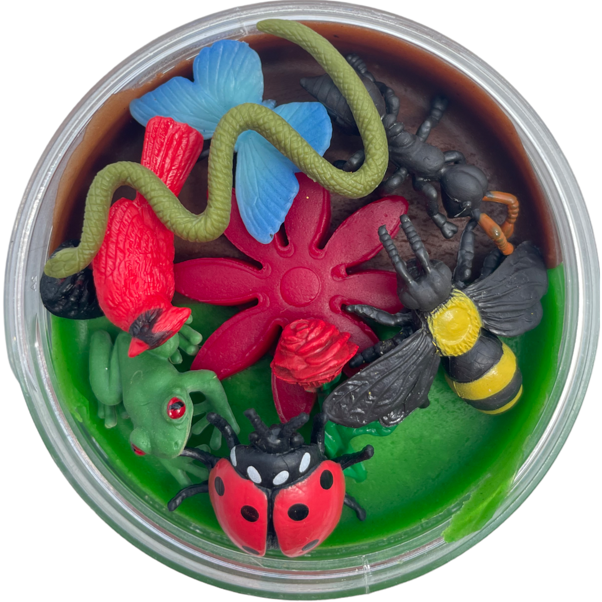 A container of Little Munchkins Playdough with various colorful miniature figures representing animals and plants, arranged to resemble a garden scene.